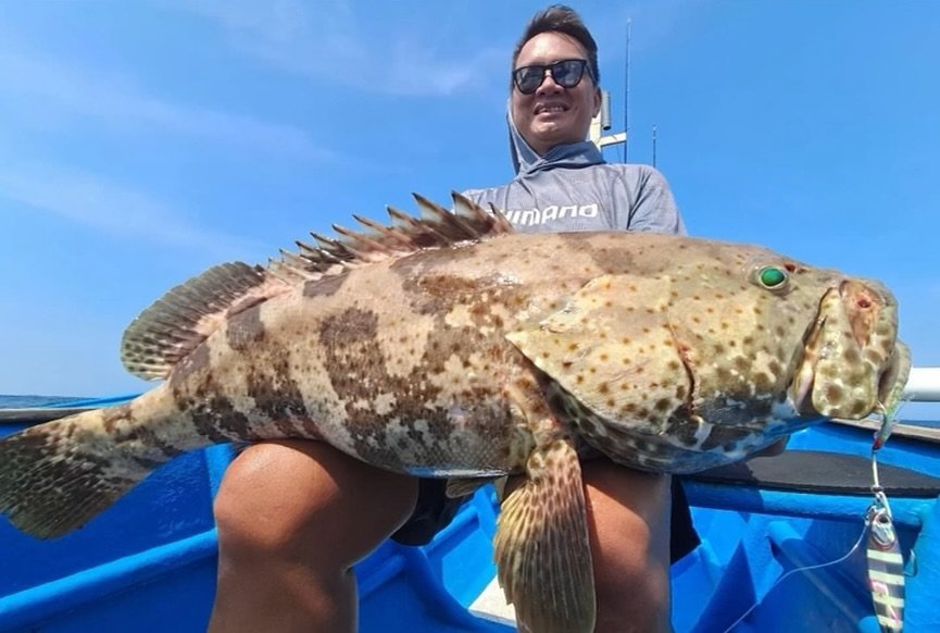 Happy fishing group photo in Bali